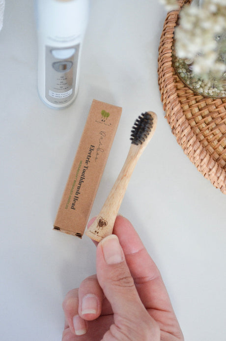 Close-up of bamboo electric toothbrush head